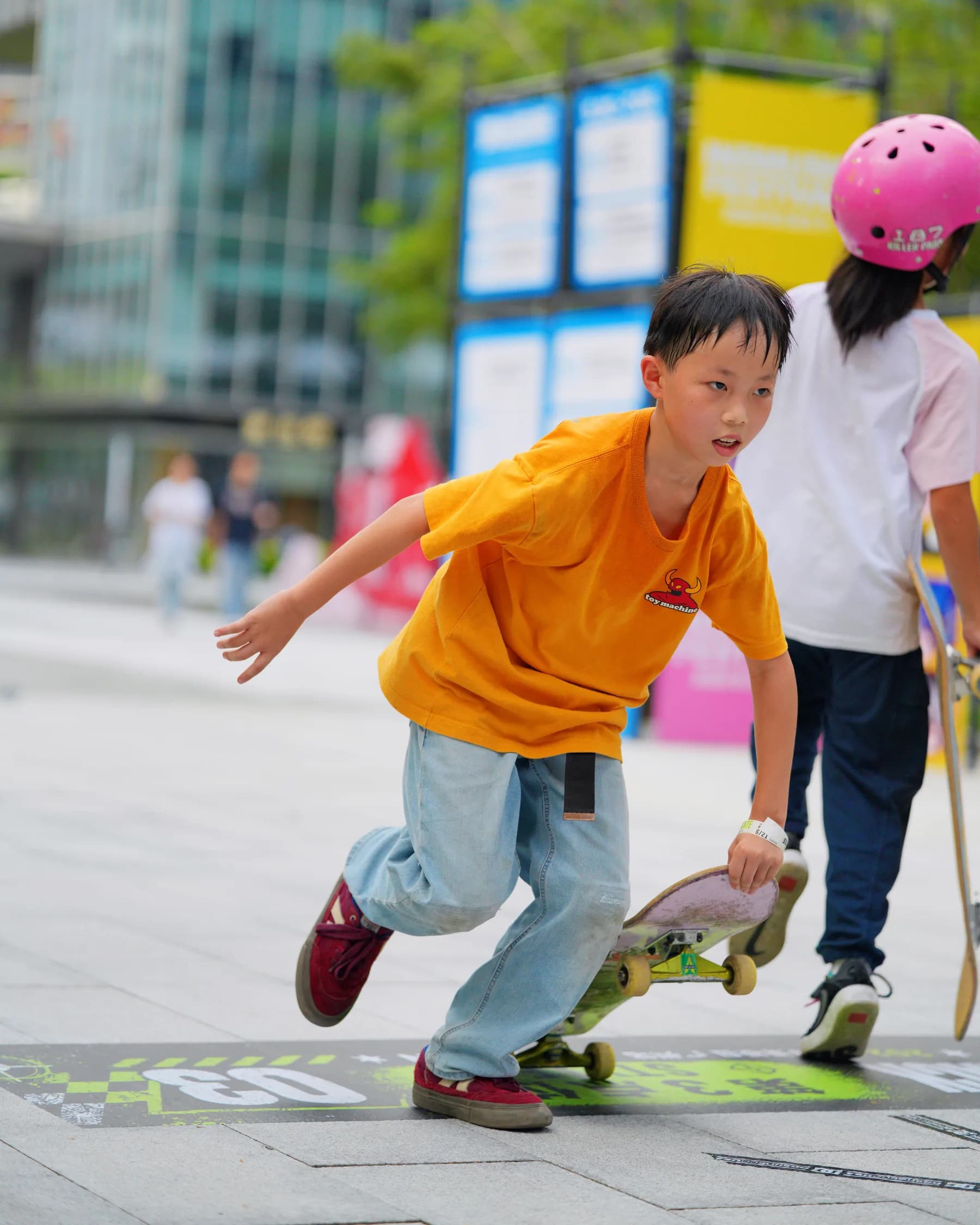 A young participant skating at the gathering